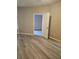 Bedroom featuring neutral paint and laminate flooring with modern doorframe at 860 Orange Ave # 259, Orlando, FL 32801