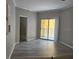 Living room with wood look floors and access to a balcony at 860 Orange Ave # 259, Orlando, FL 32801