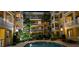 Illuminated pool area at night, highlighting the condo's architecture and tropical landscaping at 860 Orange Ave # 259, Orlando, FL 32801