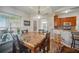 Inviting dining area featuring a stylish table set and a window with plenty of sunlight at 872 High Pointe Cir, Minneola, FL 34715