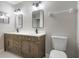 Bathroom with double sinks, modern fixtures, and stylish vanity at 8722 Village Green Blvd, Clermont, FL 34711