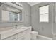 Stylish bathroom featuring a modern vanity with countertop, and a glass-enclosed shower at 929 Arbormoor Pl, Lake Mary, FL 32746