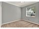 Comfortable bedroom featuring neutral paint, plush carpeting, and a bright window with natural light at 929 Arbormoor Pl, Lake Mary, FL 32746