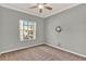 Well-lit bedroom with neutral paint, plush carpeting, and a bright window with outside view at 929 Arbormoor Pl, Lake Mary, FL 32746