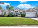 Charming single-story home featuring a well-manicured lawn, landscaping, and a two-car garage, offering great curb appeal at 929 Arbormoor Pl, Lake Mary, FL 32746