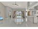 Bright and airy living room featuring marble floors, an open layout, and sliding glass doors to the pool area at 929 Arbormoor Pl, Lake Mary, FL 32746