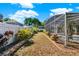 Lush landscaping surrounds the screened-in pool area of this backyard at 929 Arbormoor Pl, Lake Mary, FL 32746