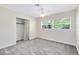 Sunlit bedroom featuring carpet floors, ceiling fan, and bright windows with blinds at 9744 Cub Cv, Apopka, FL 32703