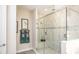 Elegant bathroom with a glass-enclosed shower featuring marble tile and modern fixtures at Tbd Shirley Shores Rd, Tavares, FL 32778