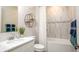 Modern bathroom with marble-style tiles, a tub, and a sleek vanity at Tbd Shirley Shores Rd, Tavares, FL 32778