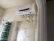 Bathroom featuring a water heater mounted on the wall above a mirror and shower at 100 John St, Frostproof, FL 33843