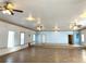 Bright interior featuring tile floors, ceiling fans, and natural lighting at 100 John St, Frostproof, FL 33843