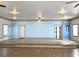 Bright interior space with tile flooring and a raised platform at 100 John St, Frostproof, FL 33843