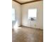 Small empty room featuring tile floors and a window with an air conditioner at 100 John St, Frostproof, FL 33843