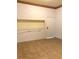 Small empty room with tile flooring and a cubby shelf at 100 John St, Frostproof, FL 33843
