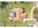 Top down aerial view of house with screened pool enclosure and solar panels at 10544 Spring Lake Dr, Clermont, FL 34711