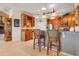 Open kitchen has a breakfast bar and stainless steel appliances at 10544 Spring Lake Dr, Clermont, FL 34711