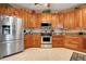Updated kitchen features stainless steel appliances, and ample counter space at 10544 Spring Lake Dr, Clermont, FL 34711