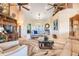 Spacious living room with vaulted ceilings, a large window, and neutral decor at 10544 Spring Lake Dr, Clermont, FL 34711