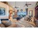 Spacious living room with vaulted ceilings, a large window, and neutral decor at 10544 Spring Lake Dr, Clermont, FL 34711