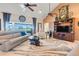 Spacious living room with vaulted ceilings, a large window, and neutral decor at 10544 Spring Lake Dr, Clermont, FL 34711