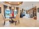 Open-concept living room features abundant natural light, comfortable seating, and expansive views of the outdoors at 10544 Spring Lake Dr, Clermont, FL 34711