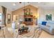 Spacious living room with vaulted ceilings, a large window, and neutral decor at 10544 Spring Lake Dr, Clermont, FL 34711
