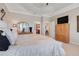 Relaxing main bedroom with neutral tones, open doorway to other rooms, and large closet space at 10544 Spring Lake Dr, Clermont, FL 34711
