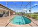 Inviting pool offers a relaxing oasis with a screened enclosure, plenty of space for lounging, and scenic views at 10544 Spring Lake Dr, Clermont, FL 34711