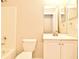 Bathroom with a vanity, toilet, and shower/tub combination with tiled walls at 107 Broadarrow Pl, Sanford, FL 32773