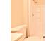 Bathroom featuring a toilet, sink, and shower with white tile surround at 107 Broadarrow Pl, Sanford, FL 32773