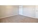 Bedroom features neutral carpet, closet, and painted walls at 107 Broadarrow Pl, Sanford, FL 32773
