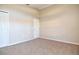 Bedroom showcasing closet space and neutral-toned carpet at 107 Broadarrow Pl, Sanford, FL 32773