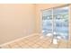 Bright dining area with tile floors and sliding glass doors leading to the outdoor patio at 107 Broadarrow Pl, Sanford, FL 32773
