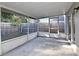 Enclosed lanai showcasing a backyard view at 107 Broadarrow Pl, Sanford, FL 32773