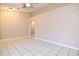 Bright living room with neutral paint, ceiling fan, and tile flooring at 107 Broadarrow Pl, Sanford, FL 32773