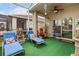 Comfortable outdoor patio seating with ceiling fan and water feature at 10942 High Bush Ct, Orlando, FL 32825