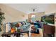 Upstairs living room boasting lots of space with a large blue sofa and mounted TV at 10942 High Bush Ct, Orlando, FL 32825