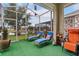 Screened patio with lounge chairs and lush outdoor views at 10942 High Bush Ct, Orlando, FL 32825