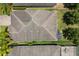 Aerial view of the home, highlighting the pool, skylights, and landscaping at 10942 High Bush Ct, Orlando, FL 32825