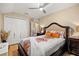 Comfortable bedroom boasts a neutral palette, generous closet space, and stylish furnishings at 10942 High Bush Ct, Orlando, FL 32825