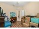 Spacious bedroom features wood floors and ample storage, perfect for organization or customization at 10942 High Bush Ct, Orlando, FL 32825