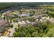 Aerial view of a residential area showcasing homes around a pond at 10942 High Bush Ct, Orlando, FL 32825