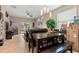 Open-concept living and dining area with access to the backyard through sliding glass doors at 10942 High Bush Ct, Orlando, FL 32825