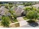 Inviting single-Gathering home featuring a stone-accented facade and a well-manicured lawn at 10942 High Bush Ct, Orlando, FL 32825