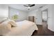 Bedroom with hardwood floors, a ceiling fan and natural light from the window at 13643 Budworth Cir, Orlando, FL 32832
