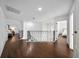 Spacious second story hallway with hardwood floors and access to bedrooms at 13643 Budworth Cir, Orlando, FL 32832
