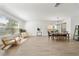 Open-concept living space with a blend of living and dining areas, perfect for entertaining and modern living at 13643 Budworth Cir, Orlando, FL 32832