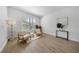 Cozy living room with neutral decor, natural light from a large window, and stylish furnishings at 13643 Budworth Cir, Orlando, FL 32832