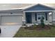 Charming single-Gathering home with a two-car garage, stone accents and a well-manicured lawn at 1418 Lassen St, Haines City, FL 33844